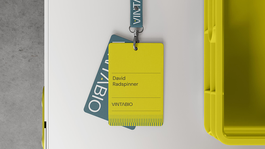 Security badge for VintaBio designed by Context, featuring bold yellow and teal colors, clean typography, and branded elements.